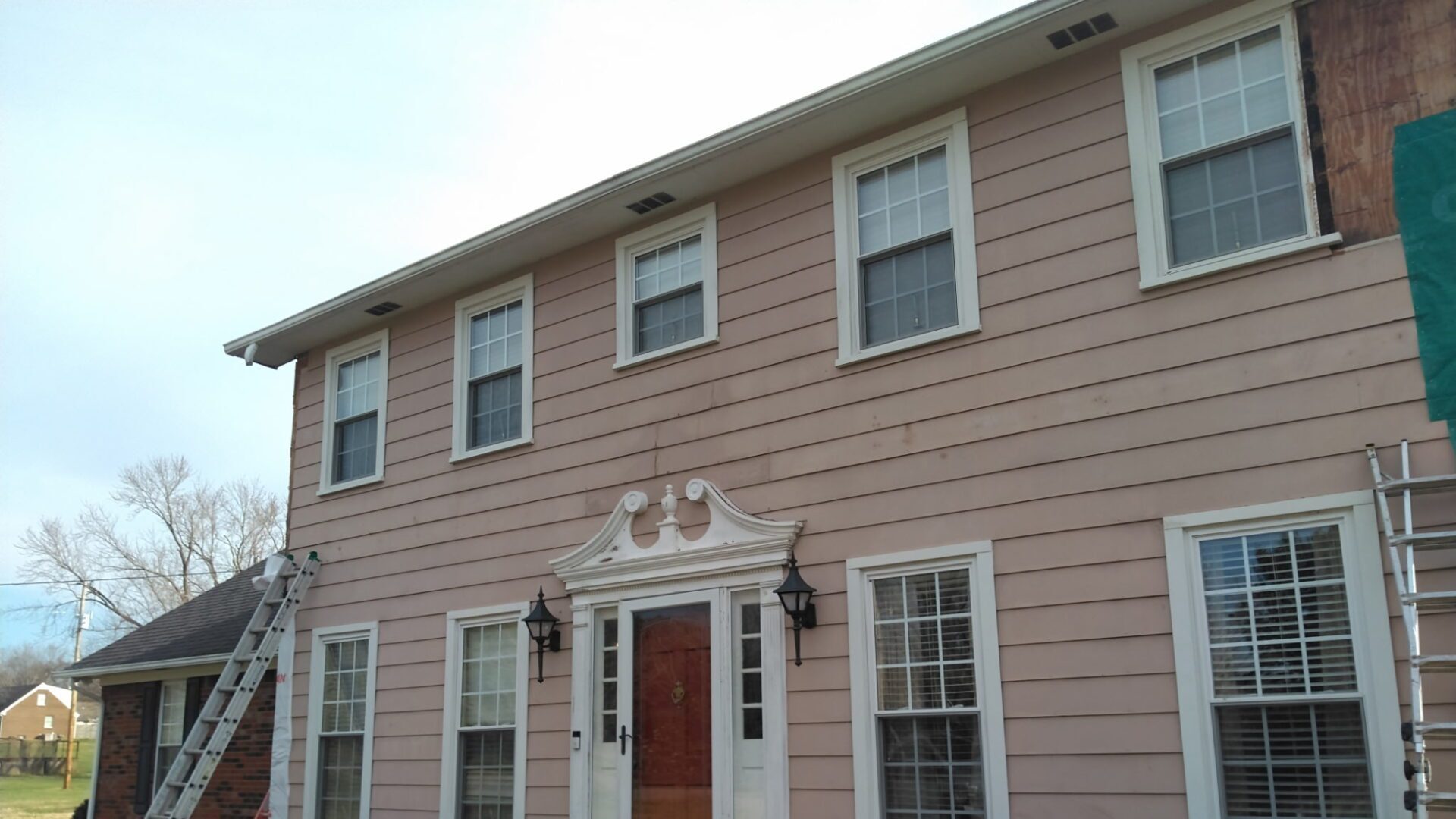 old siding- Romero's Roofing